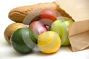 Paper bag with bread, fruits and vegetables