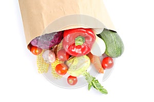 Paper bag with different vegetables isolated on white