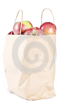 Paper Bag Full of Macintosh Apples on Its Side