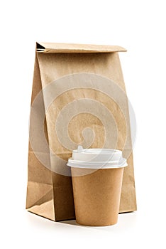 Paper bag and glass for drinks isolated on white background. set of packaging for delivery and takeaway food