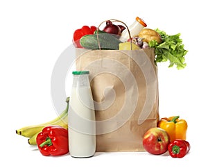 Paper bag with groceries on white