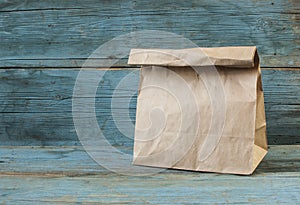 paper bag on old wooden background