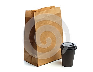 Paper bag on white background with coffee cup  Mockup for design