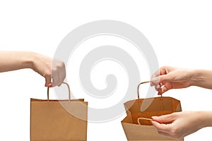 Paper bag in woman hands isolated on white background