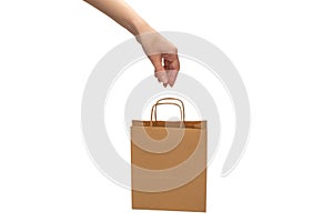 Paper bag in woman hands isolated on white background