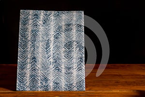 paper bag on a wooden table with black background