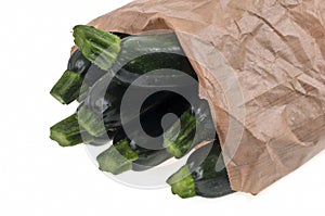 Paper bag of zucchini close up photo