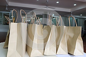 Paper bags for food or snacks stacked in bulk, recycling ideas.