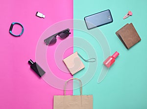 Paper bags and many purchases of gadgets and accessories on a colored background.