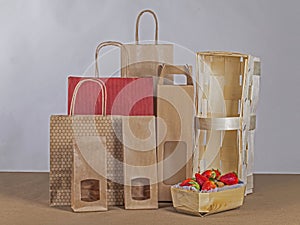 Paper bags and wooden basket