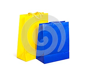 Paper bags yellow and blue on white background