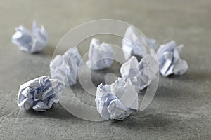 Paper balls on grey table