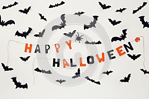 Paper bats and text Happy Halloween