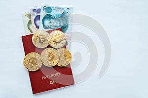Paper bills China in a red passport white background with the Chinese currency yuan, gold coins bitcoin.