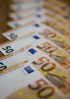 paper bills of the European currency euro laid out beautifully on the table