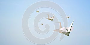Paper bird flying on Sky Background