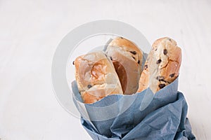 Paper blue bag with brioche mini loaves