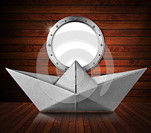 Paper Boat inside a Wooden Ship with Empty Metal Porthole