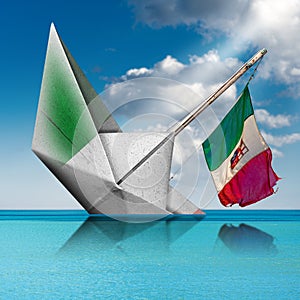 Paper boat with Italian flag is sinking into the sea - Fragility concept