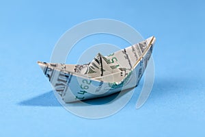 paper boat made of one american dollar
