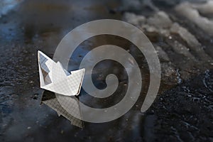 paper boat in a pool