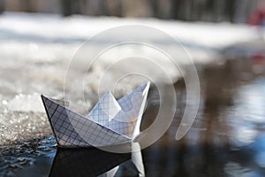 Paper boat in a pool