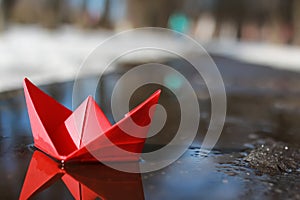 Paper boat in a pool