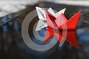 Paper boat in a pool