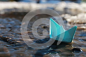 Paper boat in a pool
