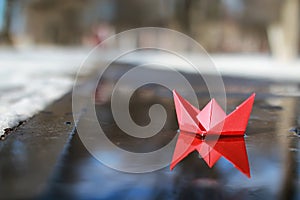 Paper boat in a pool
