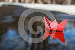 Paper boat in a pool