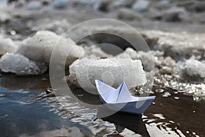 Paper boat in a pool
