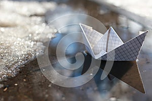 Paper boat in a pool