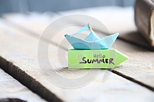 Paper boat and tag Hello Summer.