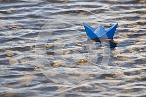 Paper boat in water