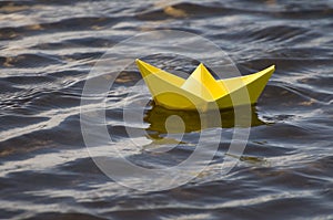 Paper boat in water