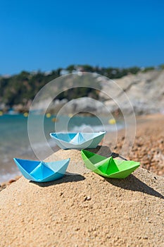 Paper boats at the beach