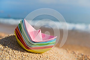 Paper boats at the beach
