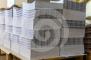 Paper books stack in printing or publishing company