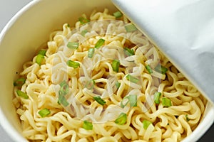 Paper bowl with cooked instant noodles, closeup