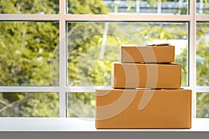 Paper boxes on table, natural background, online shopping concept