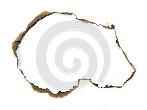 Paper burns on white backgrounds. close up hole paper with edges burned on white background.