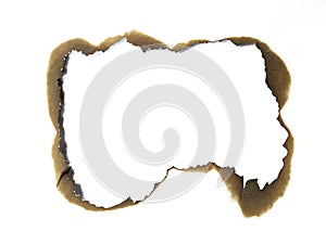 Paper burns on white backgrounds. close up hole paper with edges burned on white background.