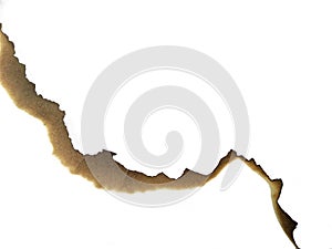 Paper burns on white backgrounds. close up hole paper with edges burned on white background.