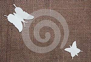 Paper butterflies on jute cloth