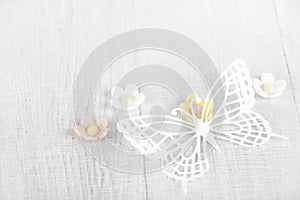 Paper butterfly and three sugar blossom flowers