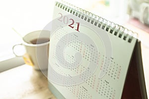 Paper calendar 2021 schedule with tea cup