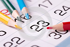 Paper calendar and pencils on the table