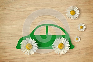 Paper car cut-out with daisy flowers - Eco-friendly car concept