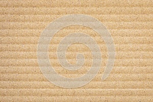 Paper cardboard background. Natural corrugated carton sheet. Kraft cardboard texture with horizontal stripes